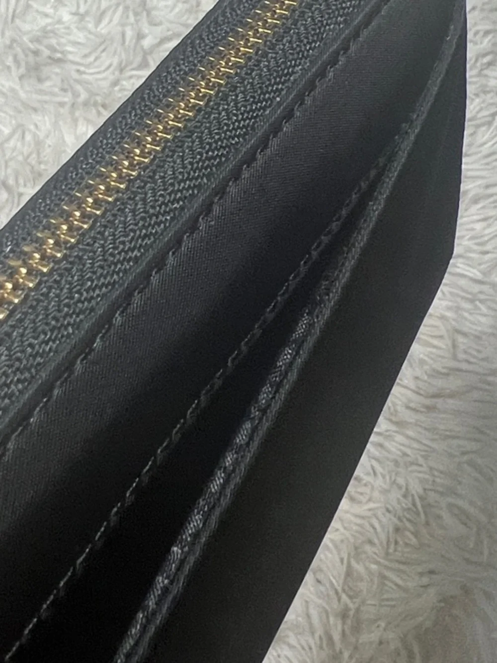 kate spade Black Zip-Around Logo Plate Wallet